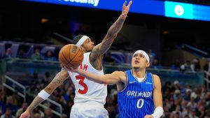 Orlando Magic guard Anthony Black (0) shoots as he gets past Toronto Raptors forward Brandon Ingram (3) during the first half of an NBA basketball game, Friday, Jan. 30, 2026, in Orlando, Fla. (John Raoux/AP)