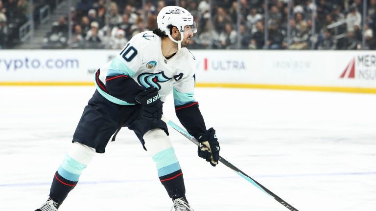 Seattle Kraken center Matty Beniers (10) skates with the puck during the third period of an NHL hockey game against the Los Angeles Kings, Tuesday, Dec. 23, 2025, in Los Angeles. (Jessie Alcheh/AP)