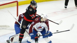 Colorado Avalanche's Taylor Makar and Ottawa Senators' Drake Batherson battle for the puck during first period NHL action in Ottawa on Wednesday, Jan. 28, 2026. (THE CANADIAN PRESS/ Patrick Doyle)