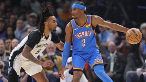 Oklahoma City Thunder guard Shai Gilgeous-Alexander (2) looks for an outlet against San Antonio Spurs guard Stephon Castle (5) during the first half of an NBA basketball game, Tuesday, Jan. 13, 2026, in Oklahoma City. (AP Photo/Nate Billings)