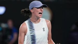 Iga Swiatek of Poland reacts after defeating Yuan Yue of China in their first round match at the Australian Open tennis championship in Melbourne, Australia, Monday, Jan. 19, 2026. (AP Photo/Aaron Favila)