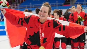 Team Canada forward Marie-Philip Poulin (29) celebrates with her gold medal after defeating the United States in women's hockey gold medal game action at the 2022 Winter Olympics in Beijing on Thursday, Feb. 17, 2022. (Ryan Remiorz/CP)