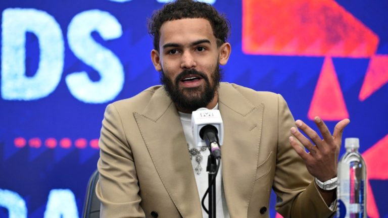 Washington Wizards newly acquired point guard Trae Young answers a question at news conference before an NBA basketball game against the New Orleans Pelicans, Friday, Jan. 9, 2026, in Washington. (AP Photo/John McDonnell)
