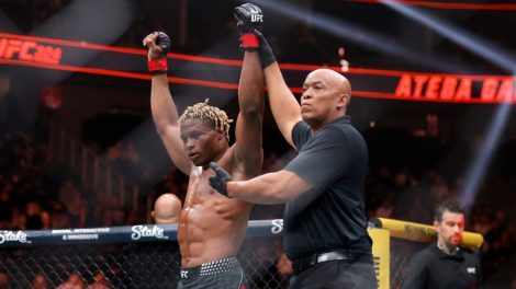 Referee-Mark-Smith,-right,-signals-middleweight-Ateba-Gautier-as-the-winner-following-a-UFC-bout-in-Las-Vegas