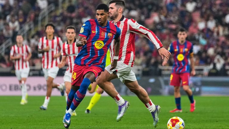 Barcelona's Marcus Rashford, foreground, views for the ball during the Spanish Super Cup semifinal soccer match against Athletic Club Bilbao at King Abdullah Sports City Stadium in Jeddah, Saudi Arabia, Wednesday, Jan. 7, 2026. (Altaf Qadri/AP)