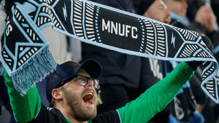 A Minnesota United fan sings after the team's win over Los Angeles FC in an MLS soccer match Saturday, March 16, 2024, in St. Paul, Minn. (Bruce Kluckhohn/AP)