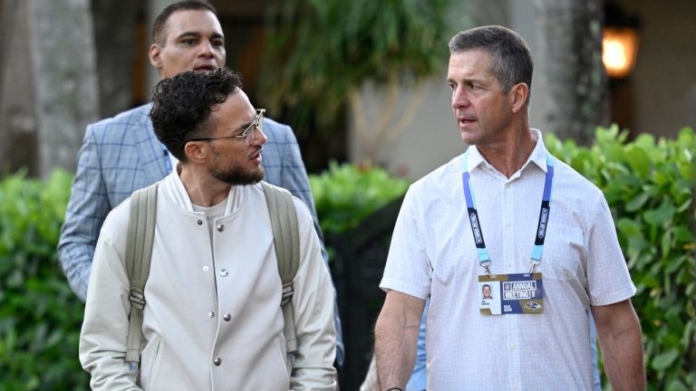 Former Miami Dolphins head coach Mike McDaniel, left, and former Baltimore Ravens head coach John Harbaugh walk to a media availability during the 2025 NFL annual meetings, Monday, March 31, 2025, in Palm Beach, Fla. (Phelan M. Ebenhack/AP)