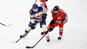 Chicago Blackhawks right wing Ilya Mikheyev (95) moves the puck against Edmonton Oilers centre Jack Roslovic (28) during the second period of an NHL hockey game, Monday, Jan. 12, 2026, in Chicago. (Matt Marton/AP)