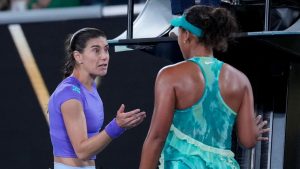 Naomi Osaka, right, of Japan talks with Sorana Cirstea, left, of Romania following their second round match at the Australian Open tennis championship in Melbourne, Australia, Thursday, Jan. 22, 2026. (AP Photo/Dita Alangkara)