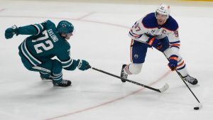Edmonton Oilers centre Connor McDavid (97) skates with the puck against San Jose Sharks left wing William Eklund (72) during the third period of an NHL hockey game in San Jose, Calif., Wednesday, April 16, 2025. (Jeff Chiu/AP)