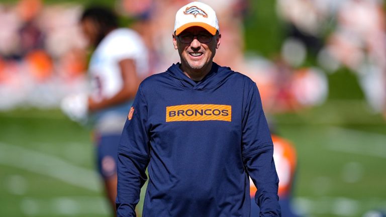 Denver Broncos senior offensive assistant Pete Carmichael takes part in drills during an NFL football training camp at the team's headquarters Thursday, Aug. 1, 2024, in Centennial Colo. (David Zalubowski/AP)