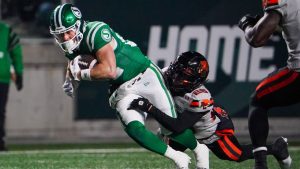 B.C. Lions defensive back Robert Carter Jr. (26) tackles Saskatchewan Roughriders receiver Joe Robustelli (82) during the first half of CFL West Division Final football action in Regina, on Saturday, November 8, 2025. (Heywood Yu/THE CANADIAN PRESS)