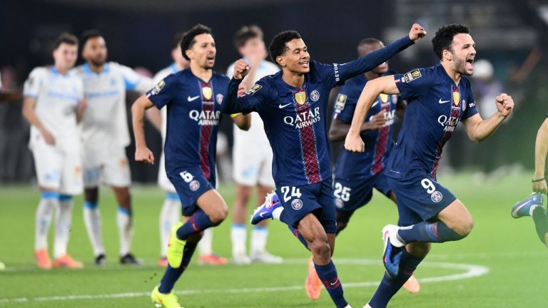 PSG's Goncalo Ramos, Senny Mayulu and Marquinhos, from right, celebrate after a penalty shootout to win the French Super Cup soccer match between PSG and Marseille in Kuwait City, Kuwait, Thursday, Jan. 8, 2026. (AP Photo/Jaber Abdulkhaleg)