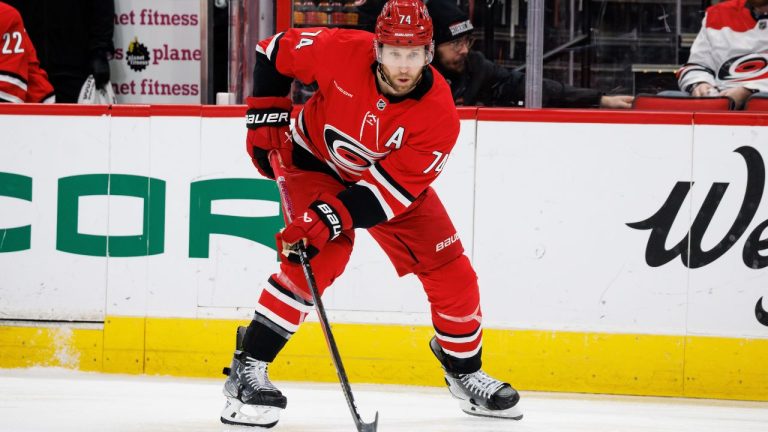 Carolina Hurricanes' Jaccob Slavin watches the puck during the second period of a game against the Philadelphia Flyers in Raleigh, N.C., Sunday, Dec. 14, 2025. (AP Photo/Ben McKeown)