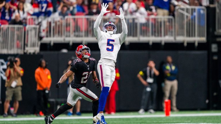 Buffalo Bills wide receiver Josh Palmer (5) jumps for a pass over Atlanta Falcons cornerback Mike Hughes (21) during the first half, Monday, Oct. 13, 2025, in Atlanta. (AP Photo/Danny Karnik)