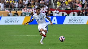 Al Hilal's Joao Cancelo (20) kicks the ball during the Club World Cup quarterfinal soccer match between Fluminense and Al Hilal, Friday, July 4, 2025 in Orlando, Fla. (Phelan M. Ebenhack/AP)