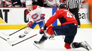 Montreal Canadiens right wing Cole Caufield (13) skates with the puck against Washington Capitals right wing Tom Wilson (43) in the second period of Game 5 of a first-round NHL hockey playoff series Wednesday, April 30, 2025, in Washington. (Nick Wass/AP)
