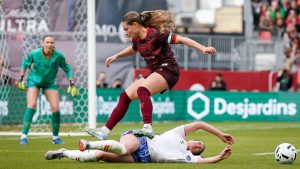 AFC Toronto defender Emma Regan (8) jumps over Montreal Roses FC Defender Lucy Cappadona (2) during second half Northern Super League soccer action in Toronto on Saturday, April 19, 2025. (Arlyn McAdorey/CP)