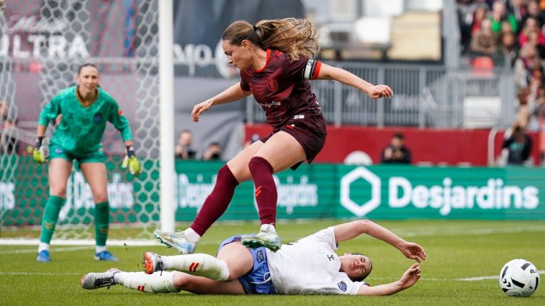 AFC Toronto defender Emma Regan (8) jumps over Montreal Roses FC Defender Lucy Cappadona (2) during second half Northern Super League soccer action in Toronto on Saturday, April 19, 2025. (Arlyn McAdorey/CP)