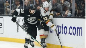 Los Angeles Kings left wing Kevin Fiala (22) and Vegas Golden Knights right wing Mitch Marner (93) fight for possession of the puck during the first period Wednesday, Jan. 14, 2026, in Los Angeles. (Caroline Brehman/AP)