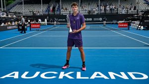 Jakub Mensik of the Czech Republic poses with his trophy after defeating Sebastian Baez of Argentina in the men's singles final of the ASB Classic in Auckland, New Zealand, Saturday, Jan. 17, 2026. (Alan Lee/ Photosport via AP)