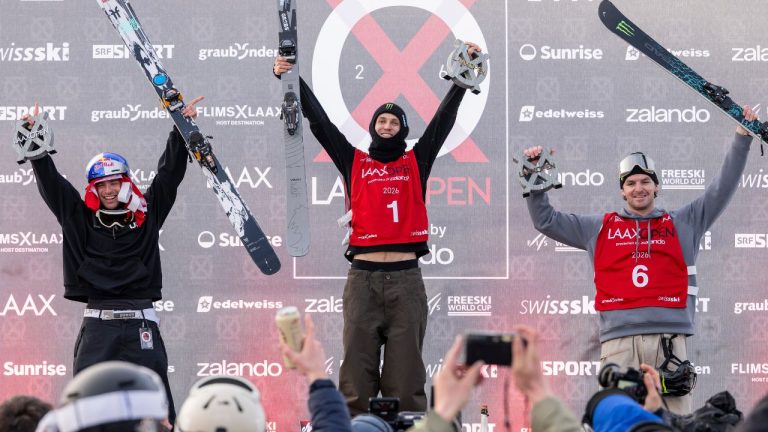 Winner Birk Ruud of Norway, center, second placed Matej Svancer of Austria, left, and third placed Evan McEachran of Canada celebrate on the podium after the final run of the Freeski Slopestyle World Cup at the Laax Open, in Laax, Switzerland. (Andreas Becker/Keystone via AP)