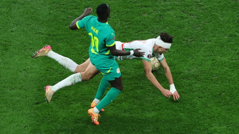 Morocco's Neil Yoni El Aynaoui is challenged by Senegal's Sadio Mane, front, during the Africa Cup of Nations final soccer match between Senegal and Morocco in Rabat, Morocco, Sunday, Jan. 18, 2026. (AP Photo/Youssef Loulidi)