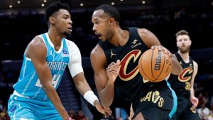 Cleveland Cavaliers centre Evan Mobley drives against Charlotte Hornets forward Brandon Miller, left, during the first half of an NBA basketball game in Charlotte, N.C., Wednesday, Jan. 21, 2026. (Nell Redmond/AP)