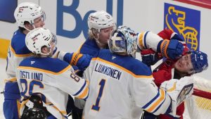 Montreal Canadiens' Zachary Bolduc (76) is cuffed by Buffalo Sabres' Rasmus Dahlin (26) as Sabres goaltender Ukko-Pekka Luukkonen (1), Noah Ostlund (86) and Mattias Samuelsson (23) look on during second period NHL hockey action in Montreal on Thursday, Jan. 22, 2026. (Christinne Muschi/CP)