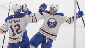 Buffalo Sabres' Beck Malenstyn (29) celebrates his goal over Montreal Canadiens with teammate Jordan Greenway (12) during first period NHL hockey action in Montreal on Thursday, Jan. 22, 2026. (Christinne Muschi/CP)