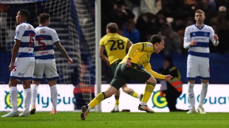 Wrexham's Ollie Rathbone, 2nd right, celebrates scoring their side's third goal of the game during the Sky Bet Championship soccer match between Queens Park Rangers and Wrexham in London, Saturday Jan. 24, 2026. (Ben Whitley/PA via AP)