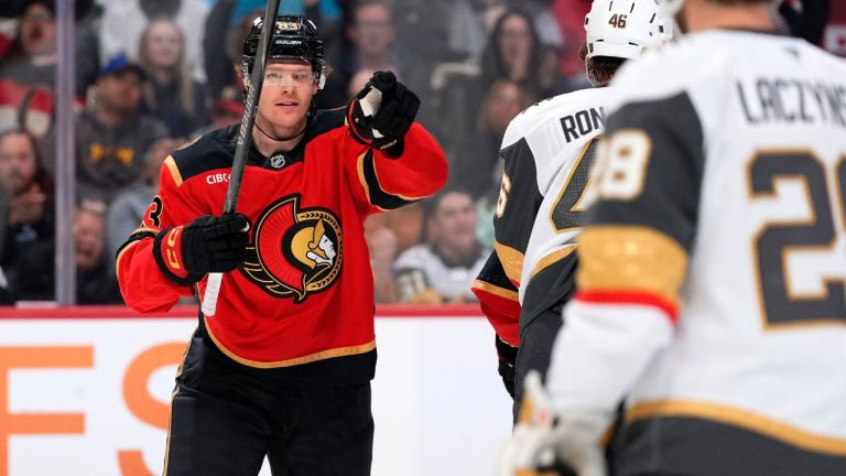 Ottawa Senators' Stephen Halliday (83) points towards Tim Stutzle (18) who earned the assist, as he celebrates scoring on the Vegas Golden Knights during second period NHL hockey action in Ottawa, on Sunday, Jan. 25, 2026. (Justin Tang/CP)