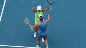 Elise Mertens of Belgium and Zhang Shuai, left, of China celebrate after defeating Anna Danilina of Kazakhstan and Aleksandra Krunic of Serbia in the women's doubles final at the Australian Open championship in Melbourne, Australia, Saturday, Jan. 31, 2026. (AP Photo/Dar Yasin)