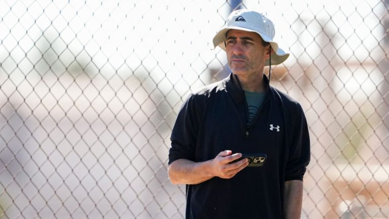 San Diego Padres general manager A.J. Preller watches a bullpen session during spring training baseball practice at the team's training facility Saturday, Feb. 15, 2025, in Peoria, Ariz. (AP Photo/Lindsey Wasson)
