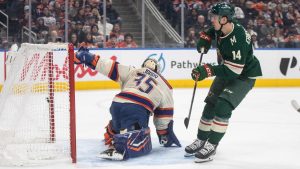 Minnesota Wild's Joel Eriksson Ek (14) scores on Edmonton Oilers goalie Tristan Jarry (35) during first period NHL action, in Edmonton on Saturday, Jan. 31, 2026. (Jason Franson/CP)