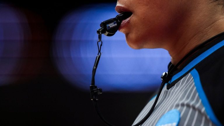 The March Madness tournament logo is seen on the whistle of official Ashlee Goode during the first half of a first-round college basketball game between Richmond and Duke in the women's NCAA Tournament, Friday, March 22, 2024, in Columbus, Ohio. (Aaron Doster/AP)