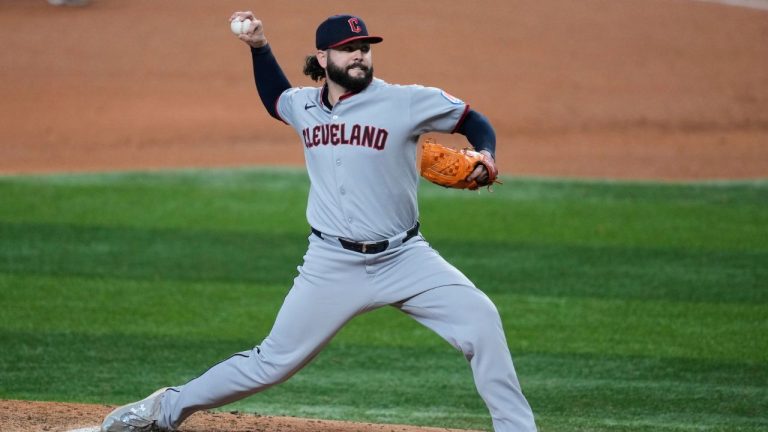 Cleveland Guardians relief pitcher Jakob Junis throws to the Texas Rangers in the sixth inning of a baseball game Sunday, Aug. 24, 2025, in Arlington, Texas. (AP Photo/Tony Gutierrez)