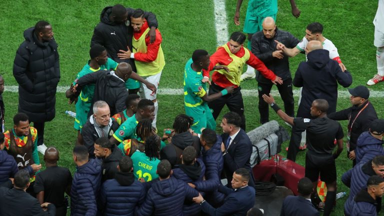 Players from both sides clash after a controversial penalty was awarded to Morocco late on during the Africa Cup of Nations final soccer match between Senegal and Morocco in Rabat, Morocco, Sunday, Jan. 18, 2026. (AP Photo/Youssef Loulidi)