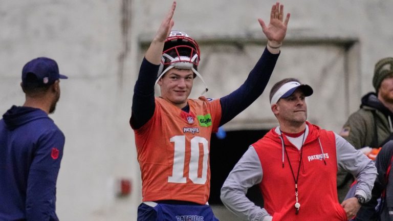 New England Patriots quarterback Drake Maye, left, signals after a field goal while standing with offensive coordinator Josh McDaniels during an NFL football availability, Thursday, Jan. 29, 2026, in Foxborough, Mass. (Charles Krupa/AP)