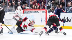 Ottawa Senators goaltender James Reimer makes a save against Columbus Blue Jackets centre Adam Fantilli during the third period of an NHL game Tuesday, Jan. 20, 2026, in Columbus, Ohio. (AP Photo/Jeff Dean)