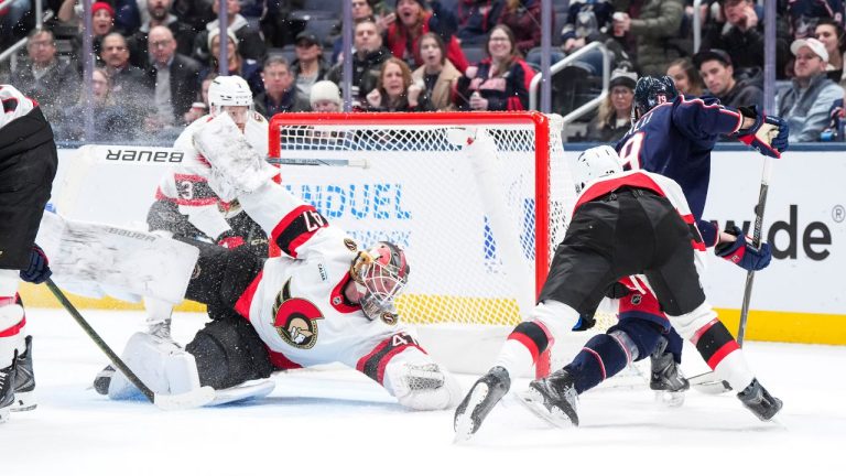 Ottawa Senators goaltender James Reimer makes a save against Columbus Blue Jackets centre Adam Fantilli during the third period of an NHL game Tuesday, Jan. 20, 2026, in Columbus, Ohio. (AP Photo/Jeff Dean)
