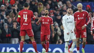 Liverpool's Mohamed Salah, centre, celebrates after scoring his side's third goal during the Champions League soccer match between Liverpool and Qarabag in Liverpool, Wednesday, Jan. 28, 2026. (Darren Staples/AP)