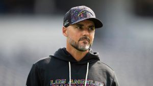 Los Angeles Chargers defensive coordinator Jesse Minter walks on the field before an NFL football game against the Washington Commanders, Sunday, Oct. 5, 2025, in Inglewood, Calif. (Kyusung Gong/AP)