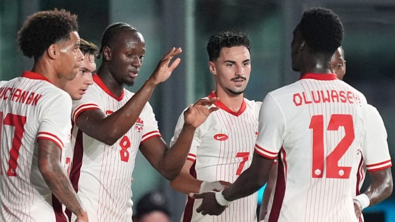 Canada midfielder Ismael Kone (8) celebrates with teammates including midfielder Stephen Eustaquio (7) after scoring his side's first goal against Venezuela during the first half of an international friendly soccer match, Tuesday, Nov. 18, 2025, in Fort Lauderdale, Fla. (Rebecca Blackwell/AP)