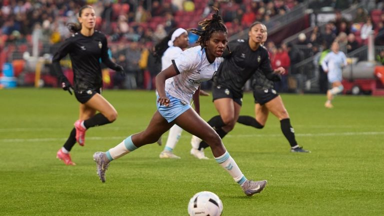 AFC Toronto forward Esther Okoronkwo vies for the ball during first-half NSL final action against Vancouver Rise FC in Toronto, on Saturday, Nov. 15, 2025. (Sammy Kogan/CP)
