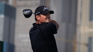 Patrick Reed of the United States watches the ball after teeing off at first hole during second round of the Dubai Desert Classic in United Arab Emirates, Friday, Jan. 23, 2026. (Altaf Qadri/AP)
