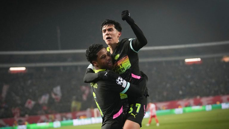 PSV's Ryan Flamingo, left, celebrates with PSV's Richard Ledezma after scoring his side's third goal during the Champions League opening phase soccer match between Red Star and PSV at the Rajko Mitic Stadium in Belgrade, Serbia, Tuesday, Jan. 21, 2025. (Darko Vojinovic/AP)