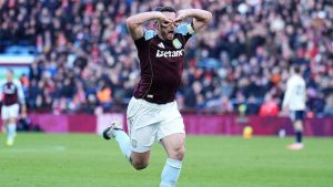 Aston Villa's John McGinn celebrates scoring their side's third goal during their English Premier League soccer match in Birmingham, England, Saturday, Jan. 3, 2026. (Martin Rickett/PA via AP)