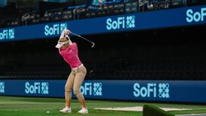 Brooke Henderson hits a shot at the SoFi Center. (TGL)