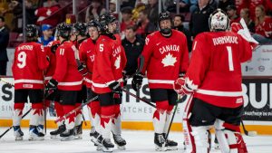 Canada goaltender Jack Ivankovic (1) celebrates with teammates after Canada defeated Slovakia in quarterfinal hockey action at the 2026 IIHF World Junior Championship, in Minneapolis, Minn., on Friday, January 2, 2026. (Christopher Katsarov/CP)